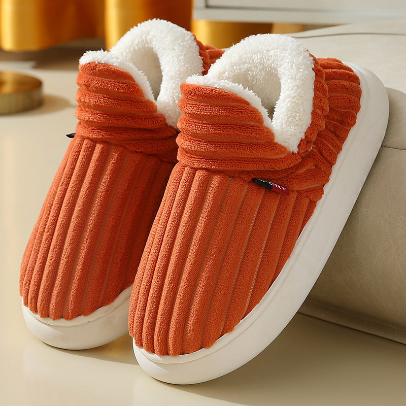 Orange fleece-lined cotton slippers with anti-slip soles and plush interior, perfect for indoor warmth and comfort in winter.