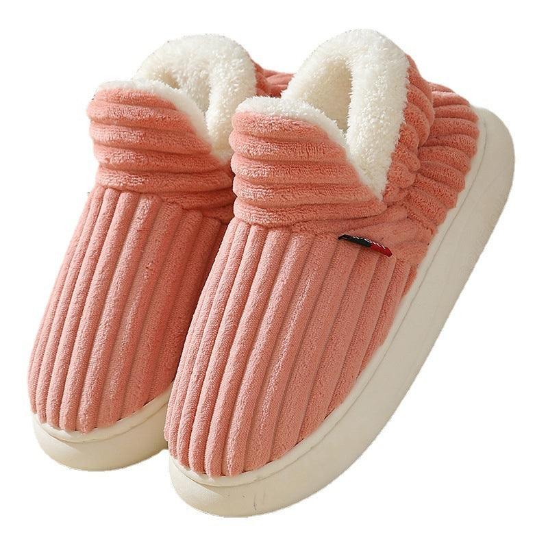 Cozy pink plush winter slippers with fleece lining and anti-slip soles, perfect for indoor warmth and comfort.